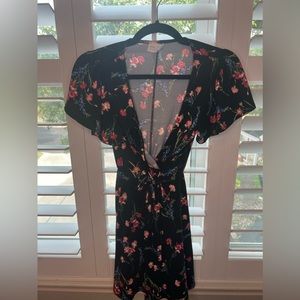 Super cute black floral mini dress, made with stretchy fabric.